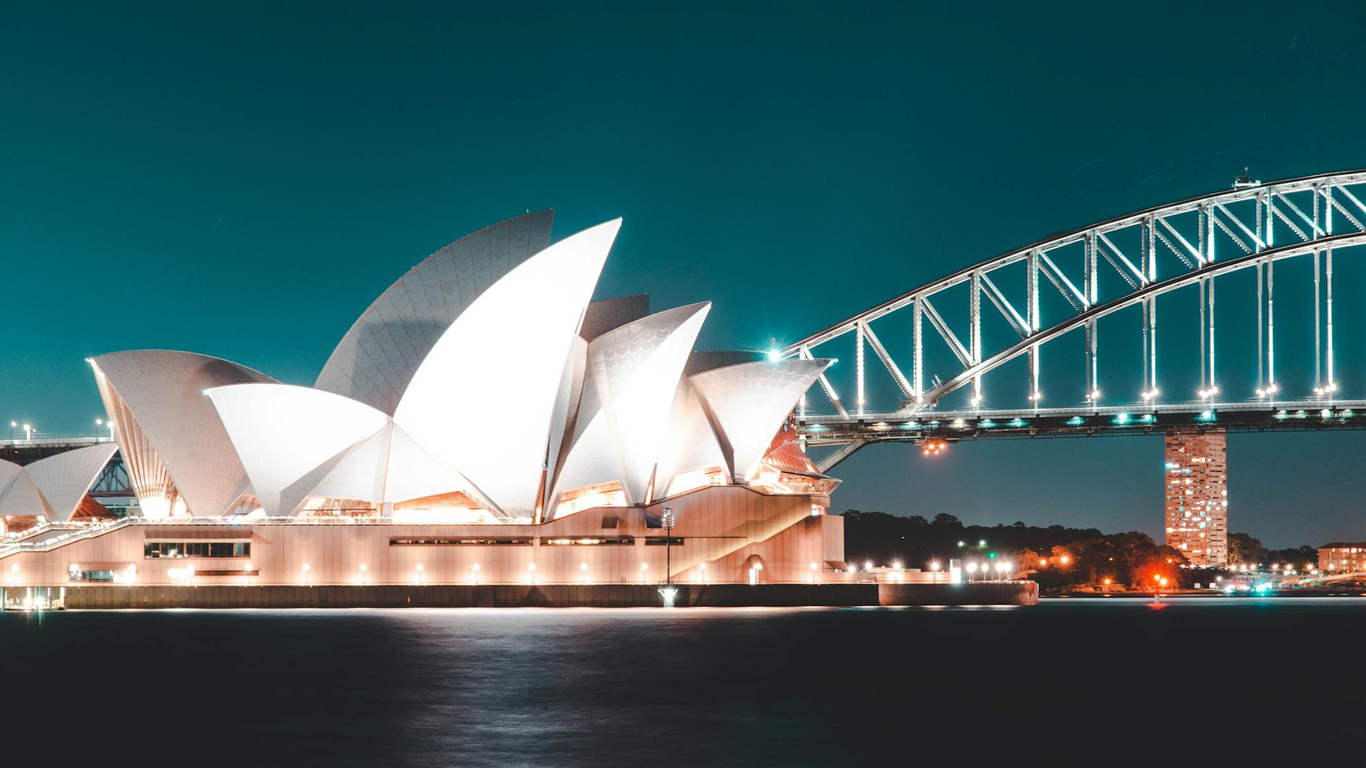 Discover Australia with the Best Travel Agency Experience the iconic Sydney Opera House and Harbour Bridge under the stars with our tailor-made travel packages. Let the best travel agency guide you to unforgettable adventures in Australia!